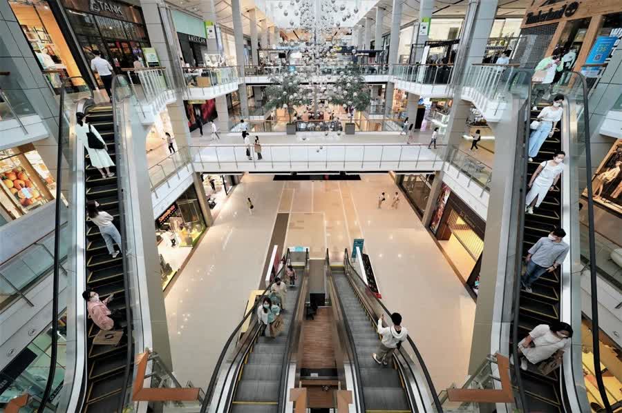 People line up to enter shopping malls